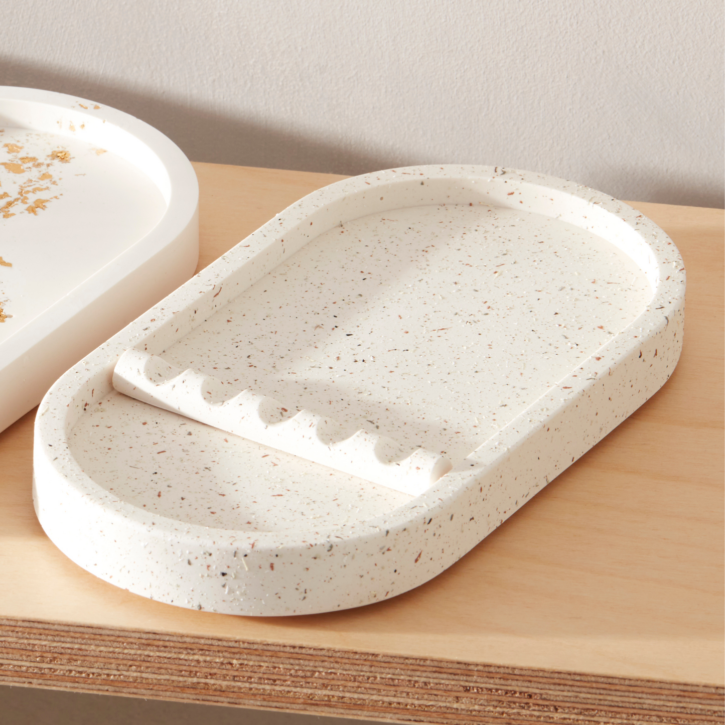 Speckled ceramic dish on a wooden surface