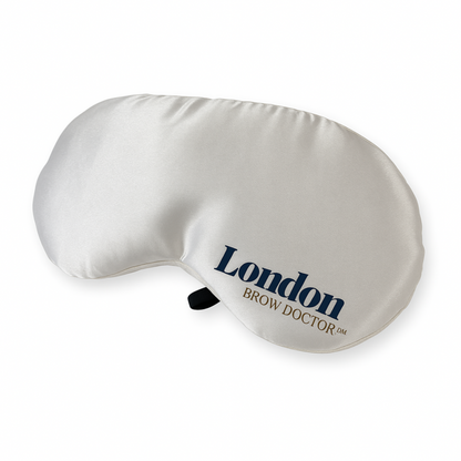 White eye mask with 'London Brow Doctor' branding on a white background