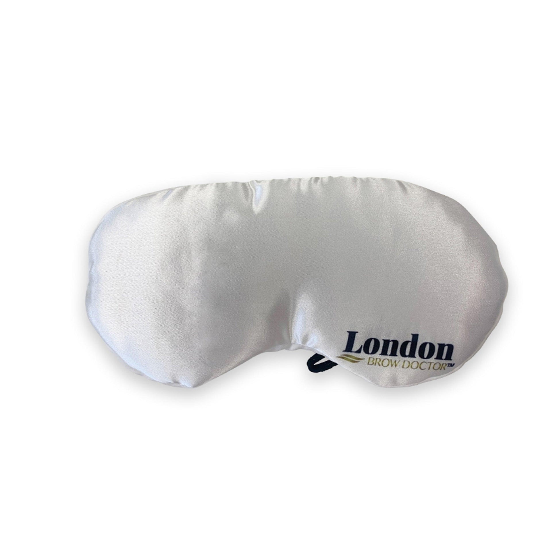 White eye mask with 'London Brow Doctor' branding on a white background