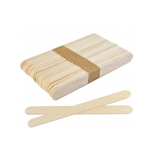 Box of wooden popsicle sticks with two sticks laid out in front on a white background